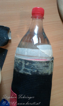 Use a bottle or milled wood to hold the suit in place. Then clean the glue area. You can use something similar like silicon cleaner