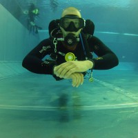 diver training in the warm water of the pool